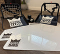 Two Saucer King product stands on a wooden floor with a white mat in front.